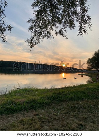 Picturesque sunset on the river with warm colors background