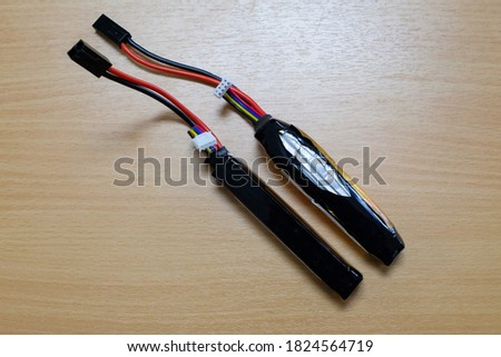 The lithium battery was swollen, damaged, and the battery normally placed in comparison on the table, lithium Battery Rechargeable Polymer or Batt Li-Po Royalty-Free Stock Photo #1824564719