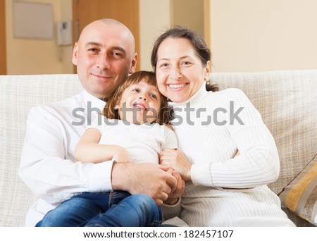Grandmother with adult son and grandaughter