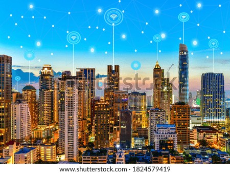 Modern city at twilight with network connection wireless communication concept	