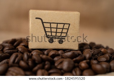 Box with shopping cart logo symbol on coffee beans, Import Export Shopping online or eCommerce delivery service store product shipping, trade, supplier concept. Royalty-Free Stock Photo #1824595520