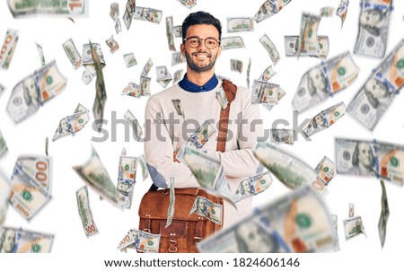 Young handsome hispanic man wearing leather bag happy face smiling with crossed arms looking at the camera. positive person.