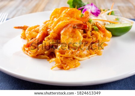 A view of a plate of shrimp pad Thai.