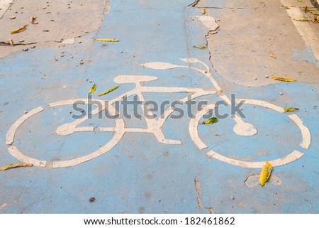 Bicycle sign on the cracked road