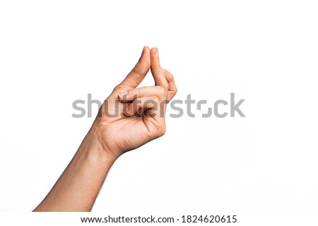 Hand of caucasian young man showing fingers over isolated white background snapping fingers for success, easy and click symbol gesture with hand Royalty-Free Stock Photo #1824620615