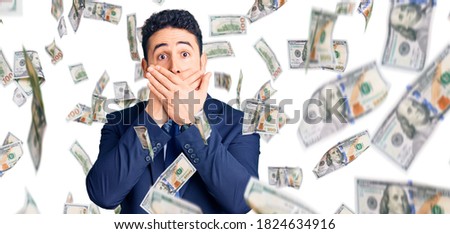 Young hispanic man wearing business clothes shocked covering mouth with hands for mistake. secret concept.