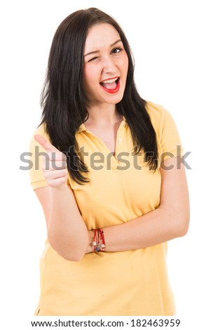 Happy woman blink her eye and giving thumb up isolated on white background