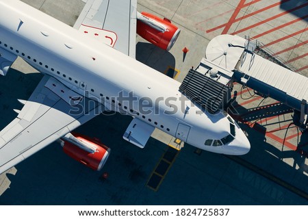 Aerial view of airport. Preparation of airplane before departure. Royalty-Free Stock Photo #1824725837