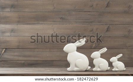 easter bunny over rustic wooden background. retro style toned picture