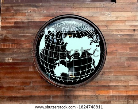 World map mirror on wooden wall. Retro wood planks without people. Vintage and Loft style.