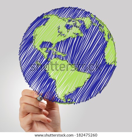 female hand drawing earth as concept 