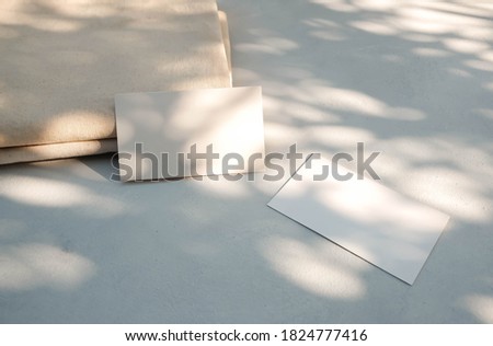 Blank business cards on gray background. Mockup scene. Template for branding identity.