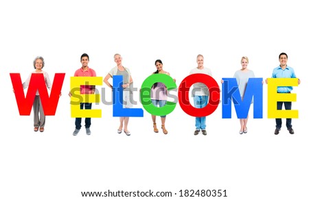 Group of People Holding The Word Welcome