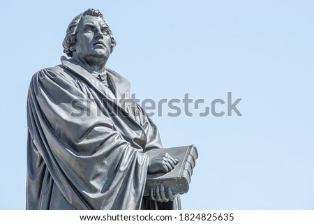 Monument of Martin Luther at  Neumarkt square in downtown of Dresden, a theologist, composer, priest, who has started Reformation in Catholic Church, with copy space for text, Germany