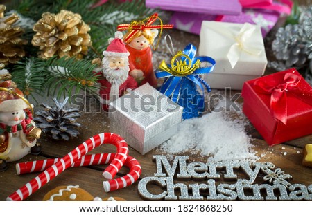 Christmas composition on the background of a Christmas tree, on a wooden background.