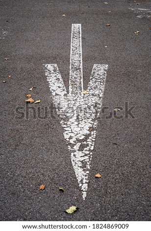 arrow road marking on the ground