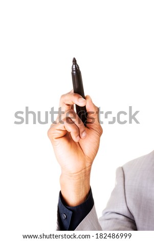 Businessman with marker pointing high