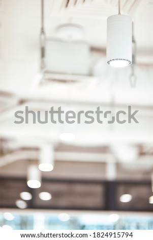 Lighting. Close up of a modern white ceiling lamp in studio