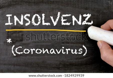 Blackboard written in german Insolvenz, engl bancruptcy and coronavirus Royalty-Free Stock Photo #1824929939