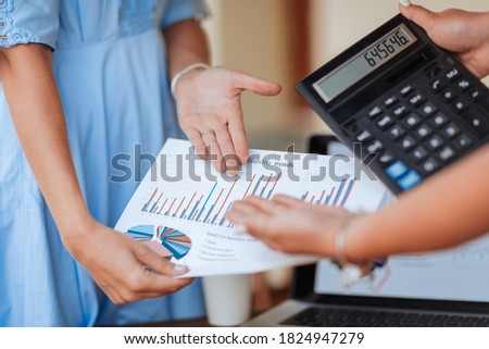 close up. business woman discussing a financial chart with colleague.