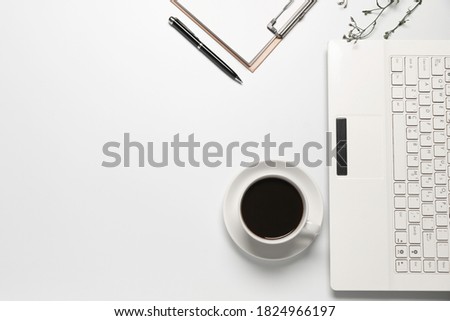 Top view coffee cup with notebook,pen or object for office supply concept on white background.
