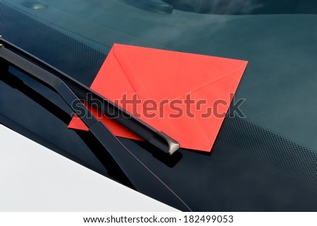 message under a windshield wiper
