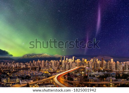 Downtown Vancouver, British Columbia, Canada. Beautiful Aerial Panoramic View of a Modern City. Cityscape Skyline. During Colorful Night with aurora borealis Composite. Dreamscape