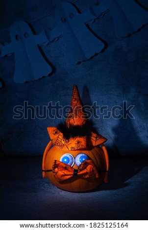 Holiday Halloween, carnival background, pumpkin with bow and hat, comic composition for Halloween, ghosts, dark scary background.
