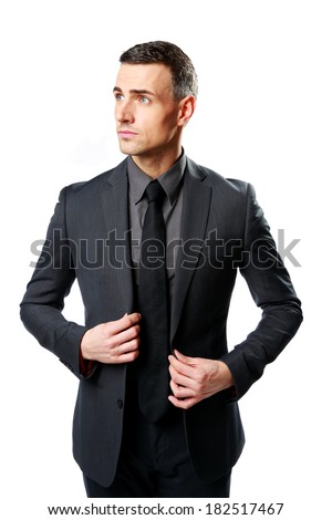 Thoughtful businessman standing isolated on a white background