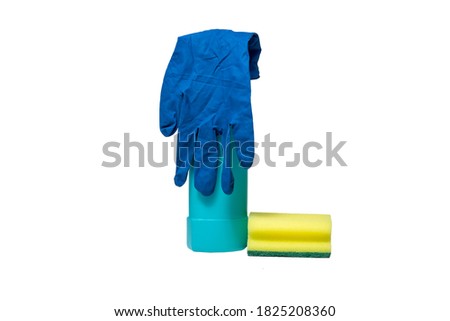 a bottle of cleaning agent, rubber gloves and a cleaning sponge. isolate on white background