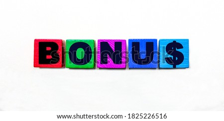 The word BONUS is written on colorful bright cubes on a light background