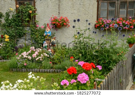 Garden gnomes of a traditional house at Tasch near Zermatt in the Swiss alps