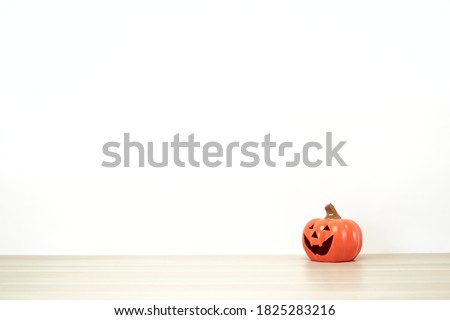 jack o lantern Lovely on decoration a shelf or desk with white wall with. Halloween concept copy space for text