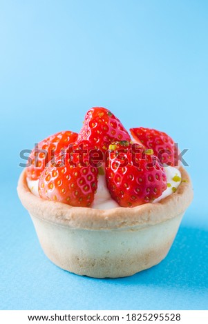 Close-up picture of a dessert topped with strawberries