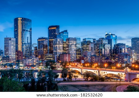 Calgary skyline at night with Bow River and Centre Street Bridge. Royalty-Free Stock Photo #182532620