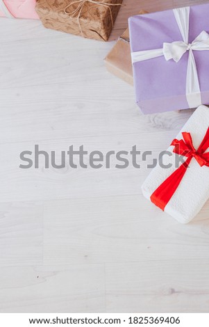lots of Christmas gifts for the new year decor white interior as a background