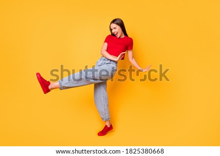 Funky lady dancing youngster moves over yellow vivid color background
