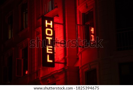 Hotel electric sign at night in Amsterdam, nightlife concept