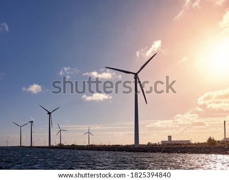 Wind turbines on the coast at sunset, Denmark.