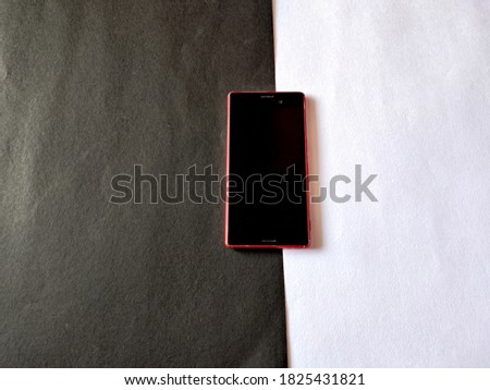 Red color smart phone.Isolated on white and black background.