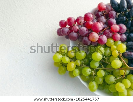 Fresh grapes in a plate stock photo