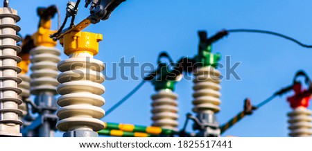 Panoramic view Electric power transmission lines in the evening. High voltage switchgear and equipment of power plant. Royalty-Free Stock Photo #1825517441