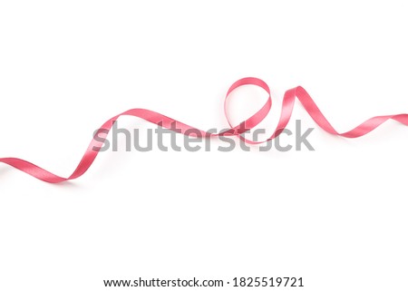 beautiful pink satin curly ribbon isolated on white background
