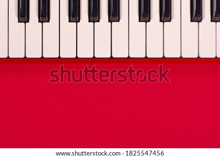 Piano keyboard isolated on colorful background with space for writing. Competition concept