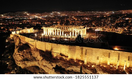 Aerial drone night shot of illuminated Acropolis hill and the Parthenon true masterpiece of ancient world, Athens, Attica, Greece