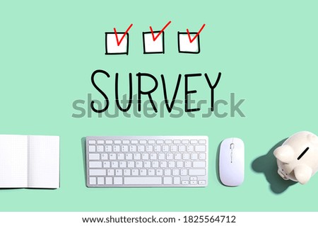 Survey with a computer keyboard and a piggy bank