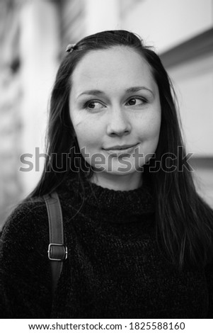 Black and white live portrait of young beautiful brunette woman with white skin