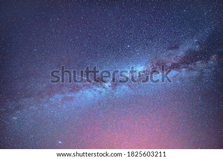 Milky Way, Andromeda Galaxy and shooting star in the night sky.