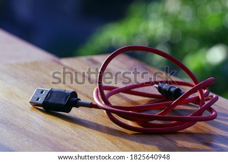 Red USB 2.0 connection with blur bokeh background.