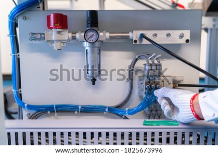 Pneumatic control valve in a steam heating system of conveyer in industrial factory.
 Royalty-Free Stock Photo #1825673996